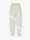 GANNI GANNI STRIPED FLARED CUFF TRACK PANTS,F345613919076