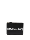 Comme Des Garçons Wallet Logo Printed Zipped Clutch Bag In Black