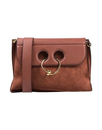 Jw Anderson Cross-body Bags In Brown