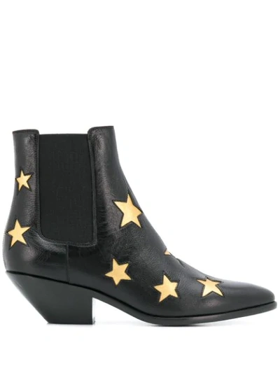 Saint Laurent Star Embossed Ankle Boots In Black,gold