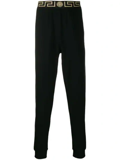 Versace 'greca' Waistband Track Trousers In Black