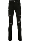 AMIRI CRYSTAL PATCH DISTRESSED SKINNY JEANS