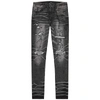 AMIRI GREY RIPPED SKINNY JEANS