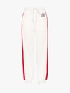 GUCCI GUCCI STRIPED TRACK PANTS,580307XJA7214020337