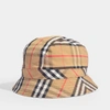 BURBERRY BURBERRY | Vintage Check Bucket Hat in Antique Yellow Cotton