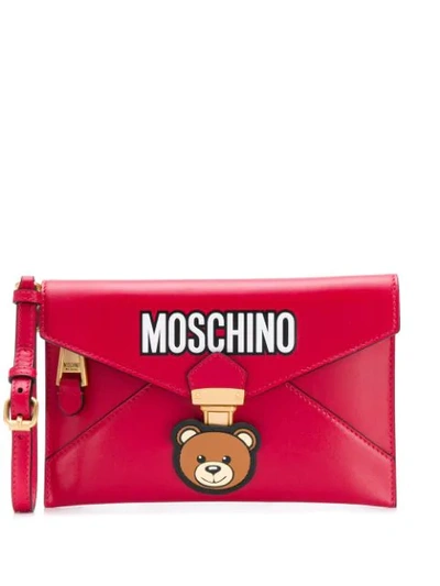Moschino Logo Print Clutch Bag In Red