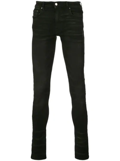 Amiri Stack Skinny Jeans In Black