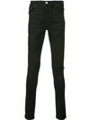 AMIRI PAINTER MILITARY PATCHES SKINNY JEANS