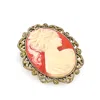2028 Gold-tone Simulated Orange Cameo Oval Brooch In Carnelian
