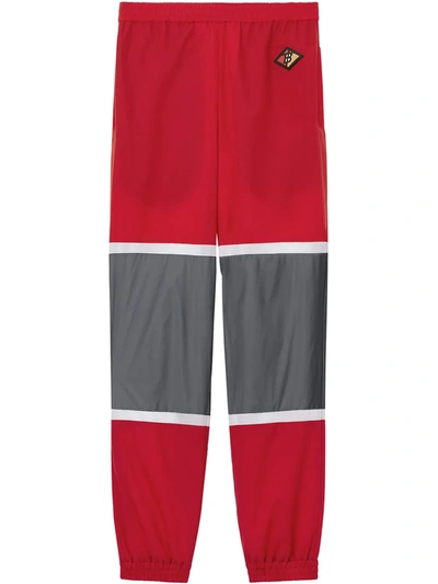 Burberry Logo Graphic Striped Nylon Trackpants In Bright Red