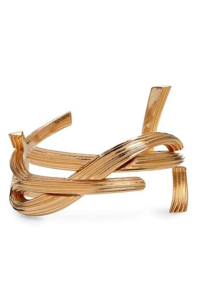 Saint Laurent Rigid Metal Monogram Shaped Bracelet In Yellow