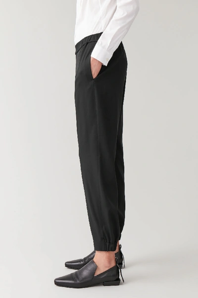 Cos Elasticated Wool-mix Trousers In Black