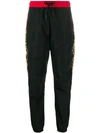 MARCELO BURLON COUNTY OF MILAN LEOPARD PRINT COLOUR-BLOCK TRACK PANTS