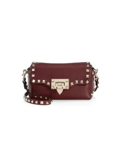 Valentino Garavani Mini Rockstud Leather Crossbody Bag In Wine