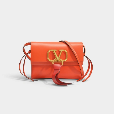 Valentino Garavani Vring Leather Crossbody Bag In Orange