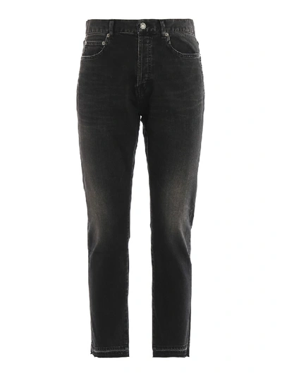 Saint Laurent Faded Jeans With Raw Cut Hem In Black