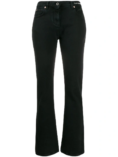 Valentino Embroidered Slogan Flared Jeans In Black