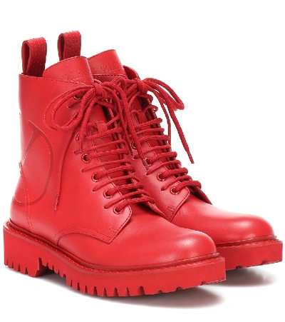 Valentino Garavani Logo Embossed Combat Boot In Red