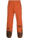 UNDERCOVER ELASTICATED UFO PRINT TRACK PANTS