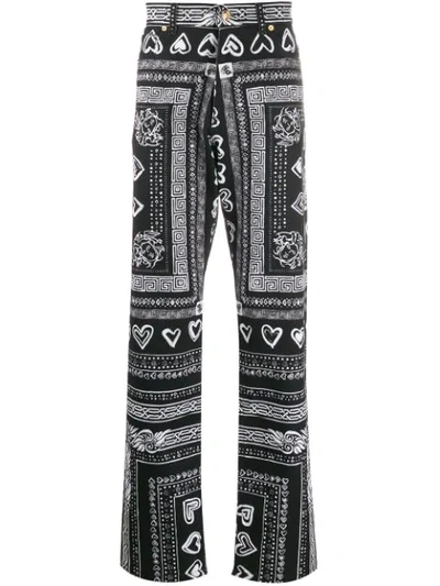 Versace Heart And Greca-print Cotton-blend Jeans In Black
