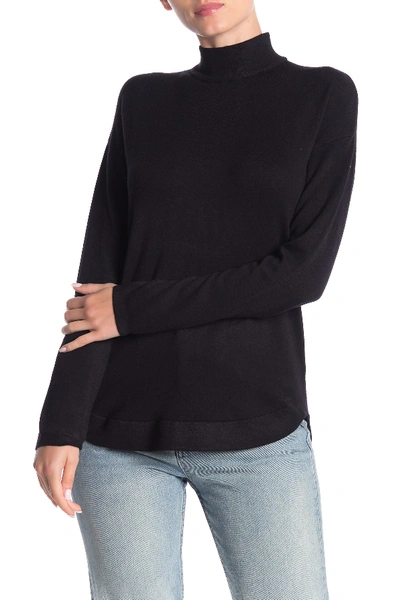 Cyrus Mock Neck Zip High/low Tunic Sweater In Black