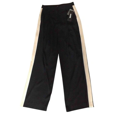 Pre-owned Dkny Trousers In Black
