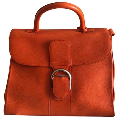 Pre-owned Delvaux Le Brillant Orange Leather Handbags