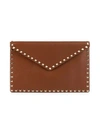 Valentino Garavani Large Rockstud Leather Clutch In Selleria