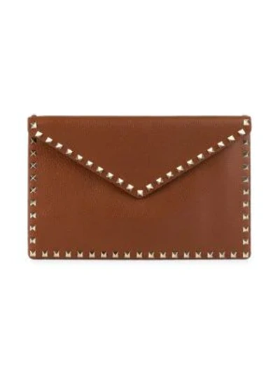 Valentino Garavani Large Rockstud Leather Clutch In Selleria