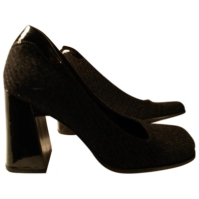 Pre-owned Prada Leather And Tweed Pumps In Black