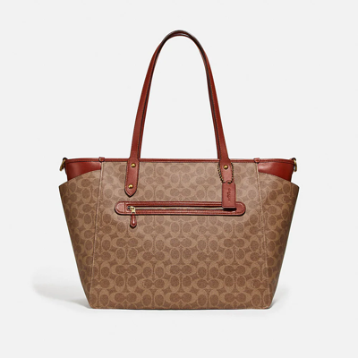 Coach Baby Bag In Signature Canvas In Brass/tan/rust