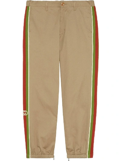 Gucci Slim-fit Webbing-trimmed Cotton-drill Trousers In Brown