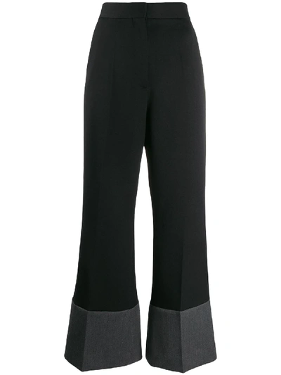 Loewe Contrasting Hem Flared Trousers In Black