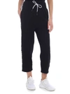 MCQ BY ALEXANDER MCQUEEN MCQ BLACK PANTS WITH BRANDED STRIPES,539835 RMJ62 1000