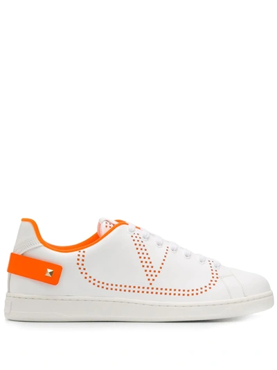 Valentino Garavani Garavani Perforated V Logo Leather Sneakers In White/neon Orange