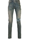 AMIRI DISTRESSED SKINNY JEANS