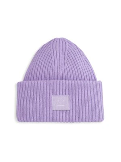 Acne Studios Kansy Logo-appliquéd Ribbed Wool-blend Beanie In Purple