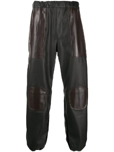 Gr-uniforma Leather Look Track Trousers In Brown