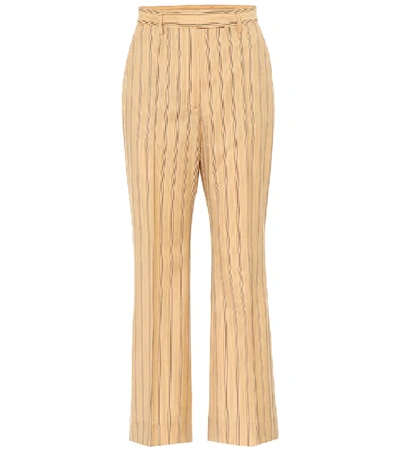 Acne Studios Flared Pinstripe Trousers Pale Orange In Yellow