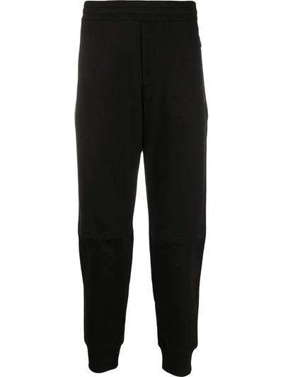 Alexander Mcqueen Embroidered Logo Patch Track Trousers In Black