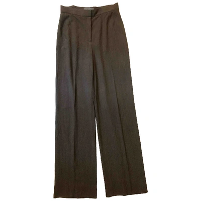 Pre-owned Genny Wool Large Trousers In Brown