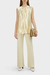 The Row Shira Sleeveless Hammered-satin Top In Ivory