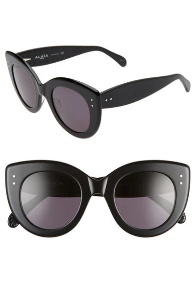 Alaïa Monochromatic Cat-eye Sunglasses In Black