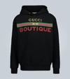 GUCCI BOUTIQUE PRINTED HOODED SWEATSHIRT,P00459473