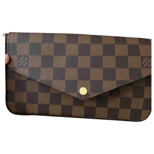 Pre-Owned Louis Vuitton FÉlicie Brown Cloth Clutch Bags | ModeSens
