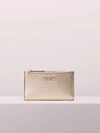 Kate Spade Spencer Small Slim Bifold Wallet In Rose Gold