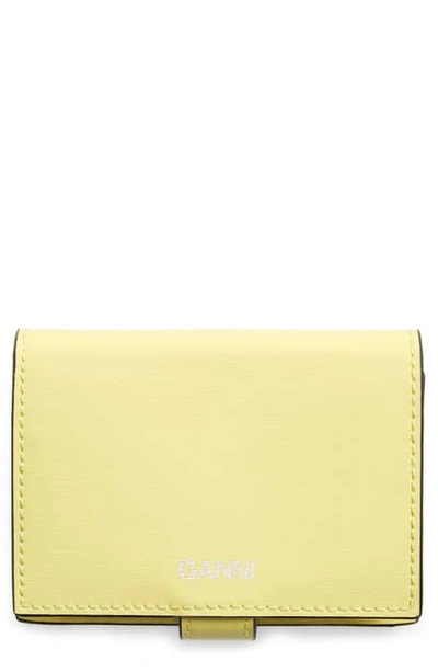Ganni Bifold Textured Leather Wallet In Lemon