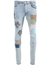 Amiri Dancing Bear-embroidered Patchwork Denim Jeans In Blue