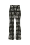 GUCCI GUCCI G PRINT FLARED PANTS