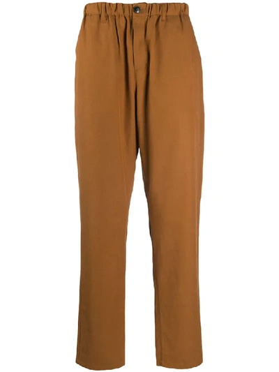 A Kind Of Guise Elasticated Waistband Trousers In Brown